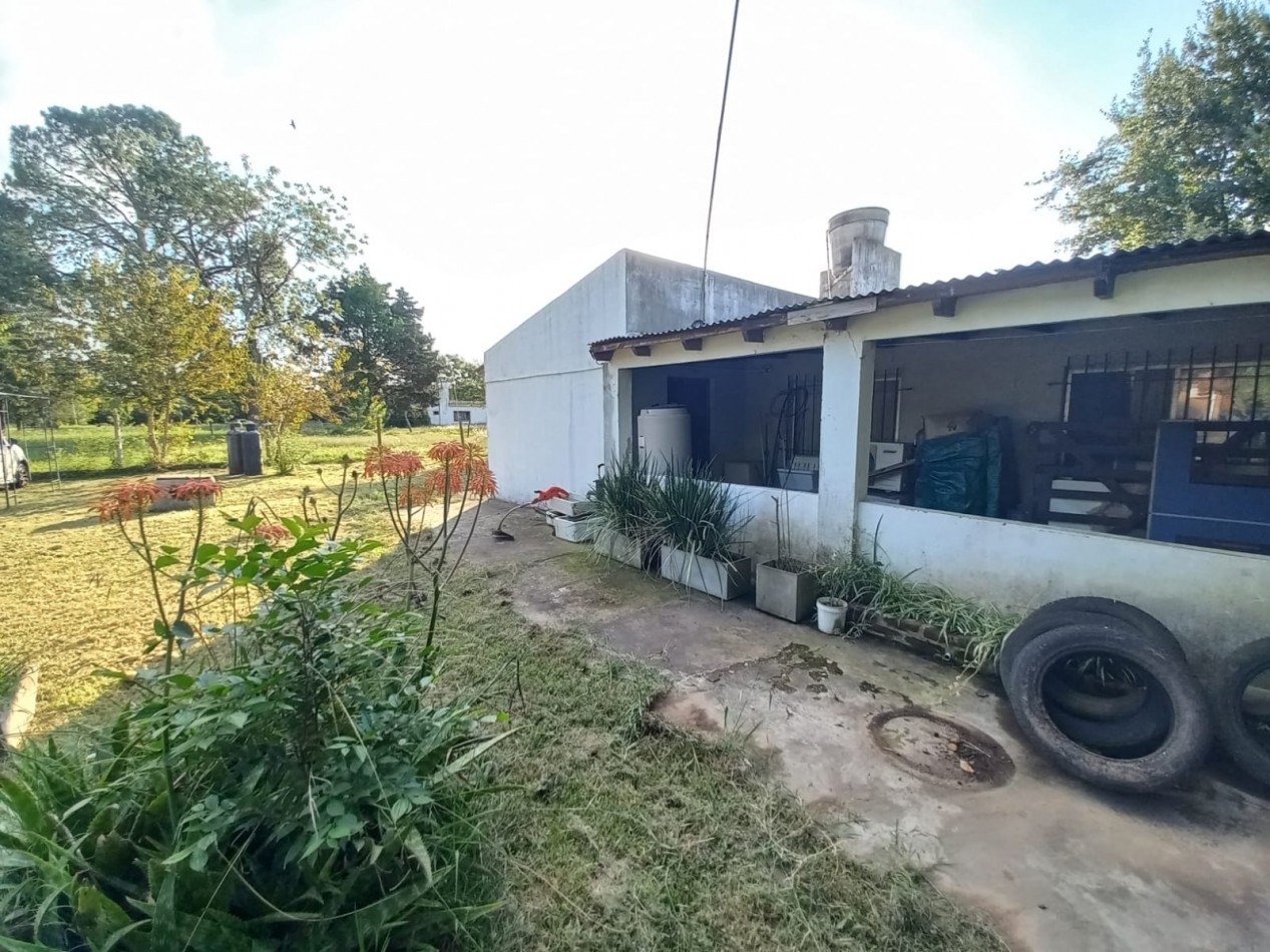 VENTA DE LOTE CON CASA EN BARRIO SEMI CERRADO